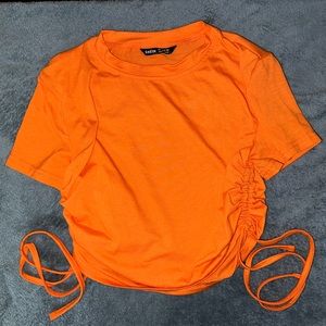 Orange side tie crop top
